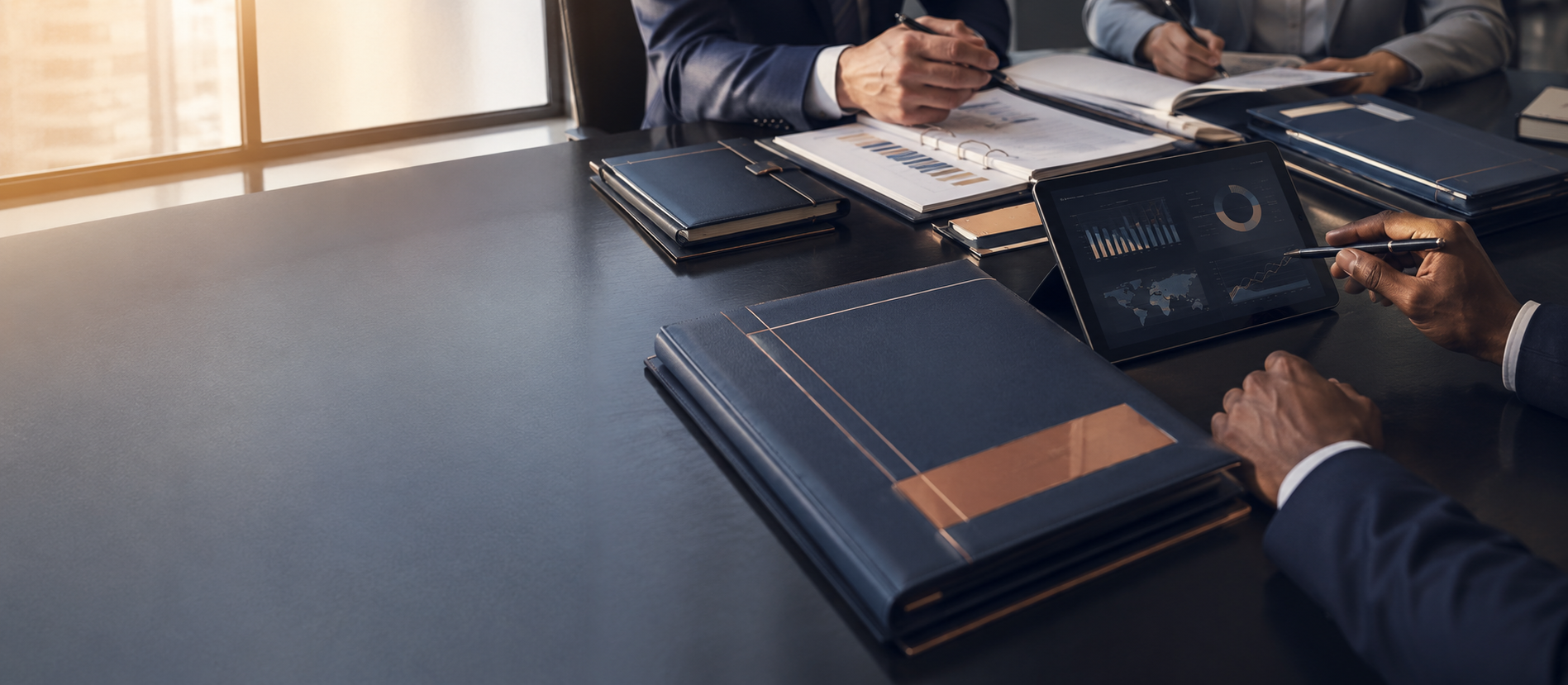 Professionals reviewing anonymized debt portfolio analytics